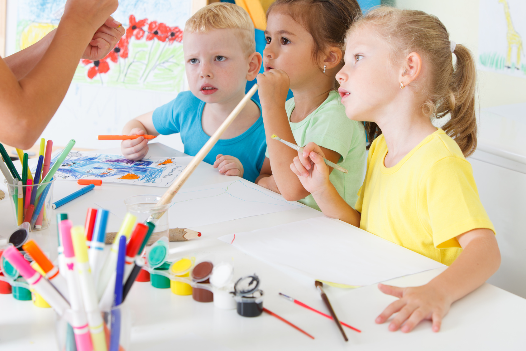 Children draw in the classroom